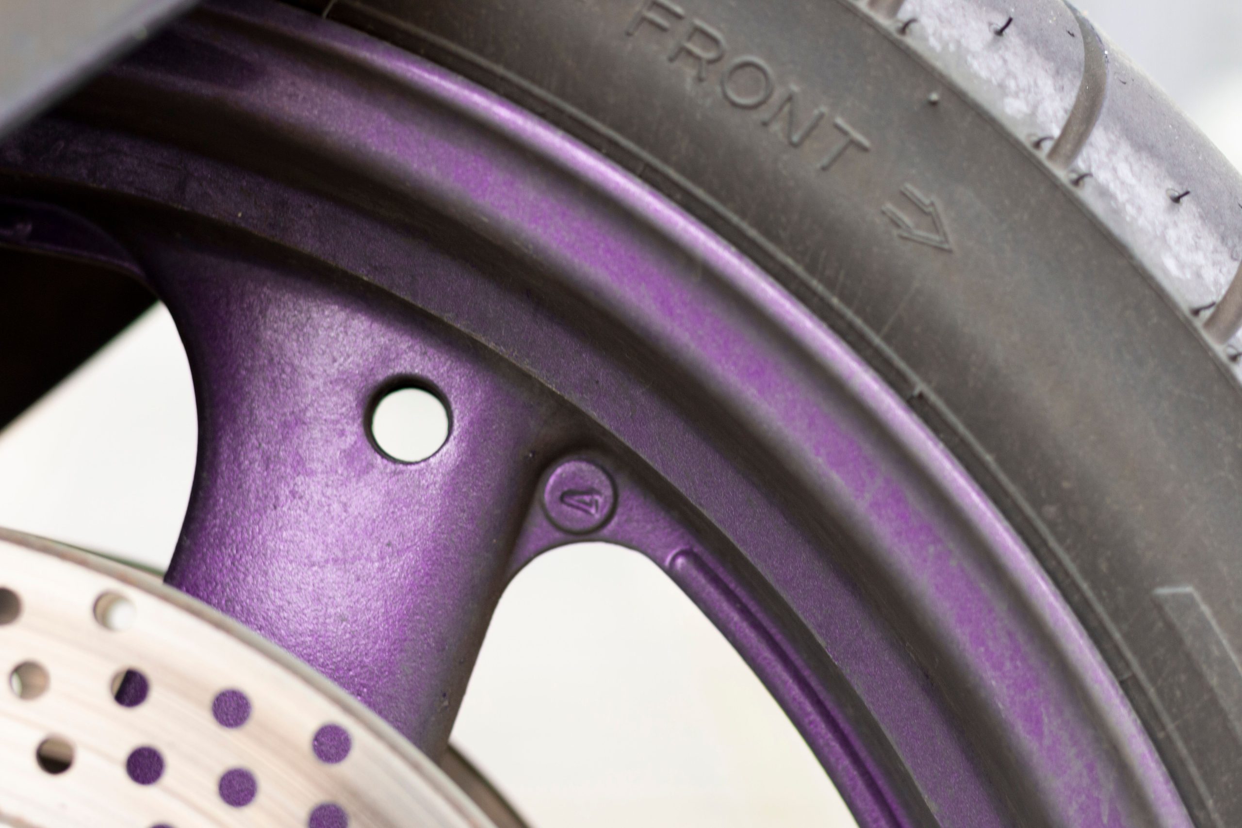 Motorcycle wheel with unique powder coat finish